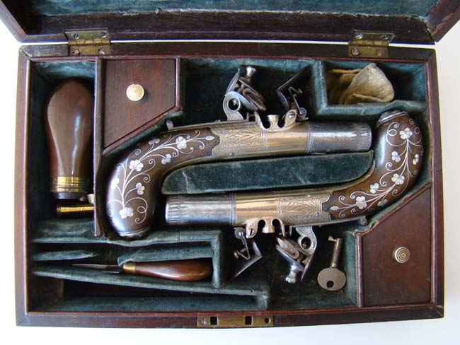 A Cased pair of Antique silver mounted Flintlock Pocket Pistols by James Collins, London, circa 1825-1832